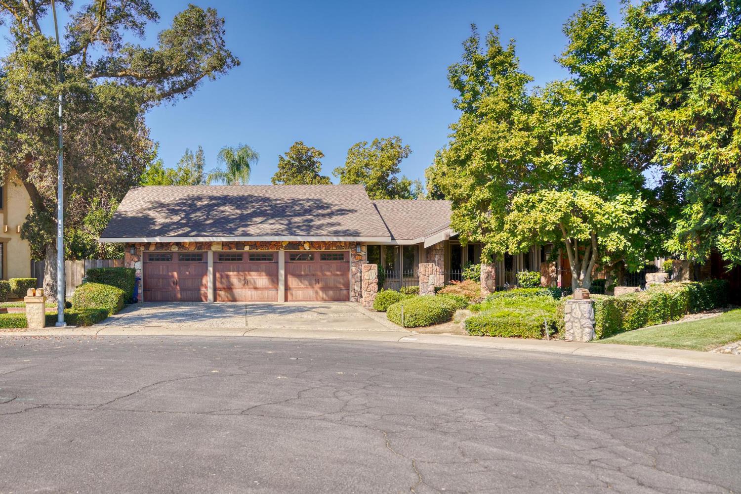 909 Sharnee Circle Modesto, CA 95355 - Photo 1 of 1 a front view of a house with a garden