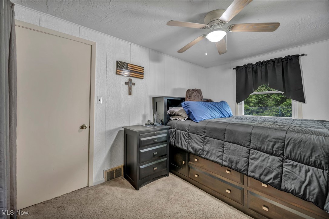 8665 Johnnycake Ridge Road Mentor, OH 44060 - Photo 29 of 49 Bedroom featuring carpet and a ceiling fan