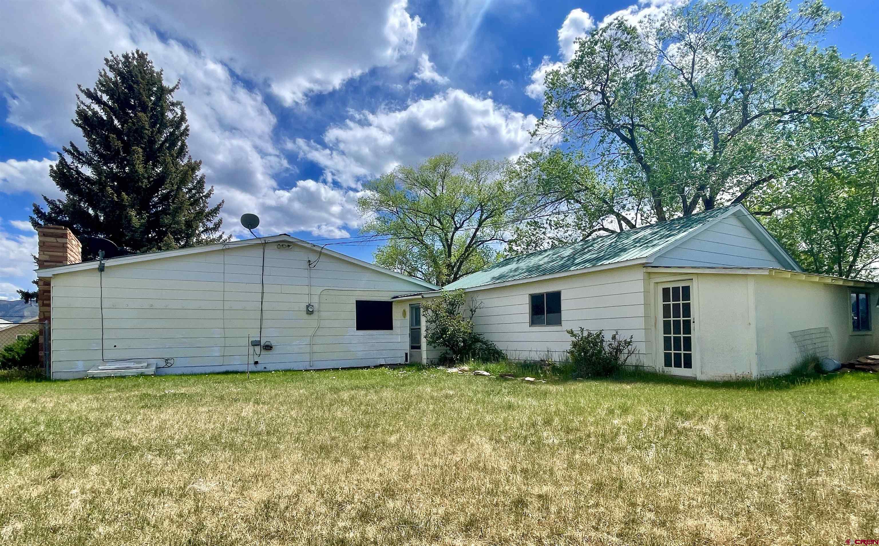 710 Canyon Drive Cortez, CO 81321 - Photo 19 of 23 a view of a house with wooden fence