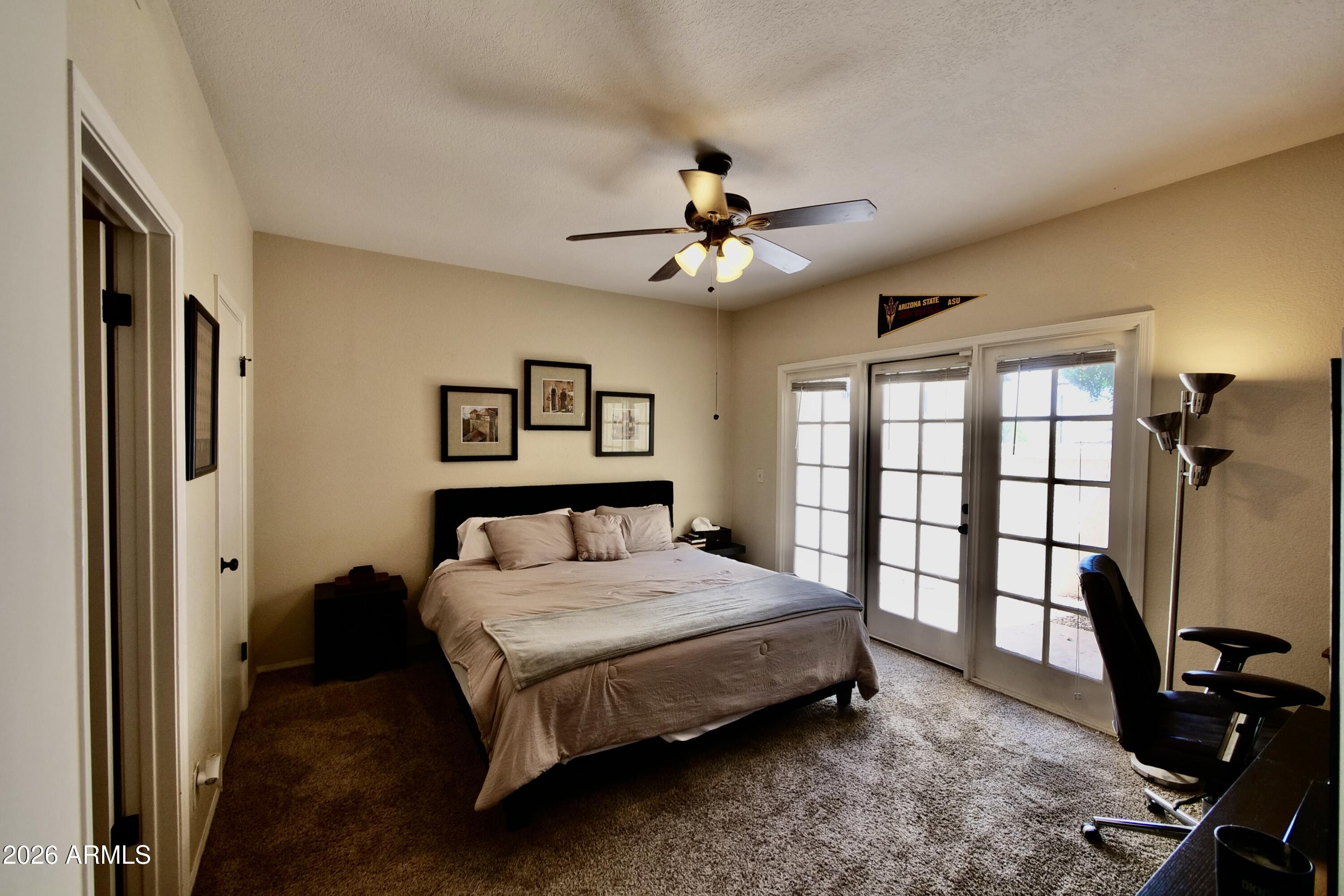 1222 West Baseline Road, Unit 156 Tempe, AZ 85283 - Photo 14 of 27 a bedroom with a bed dresser and a window