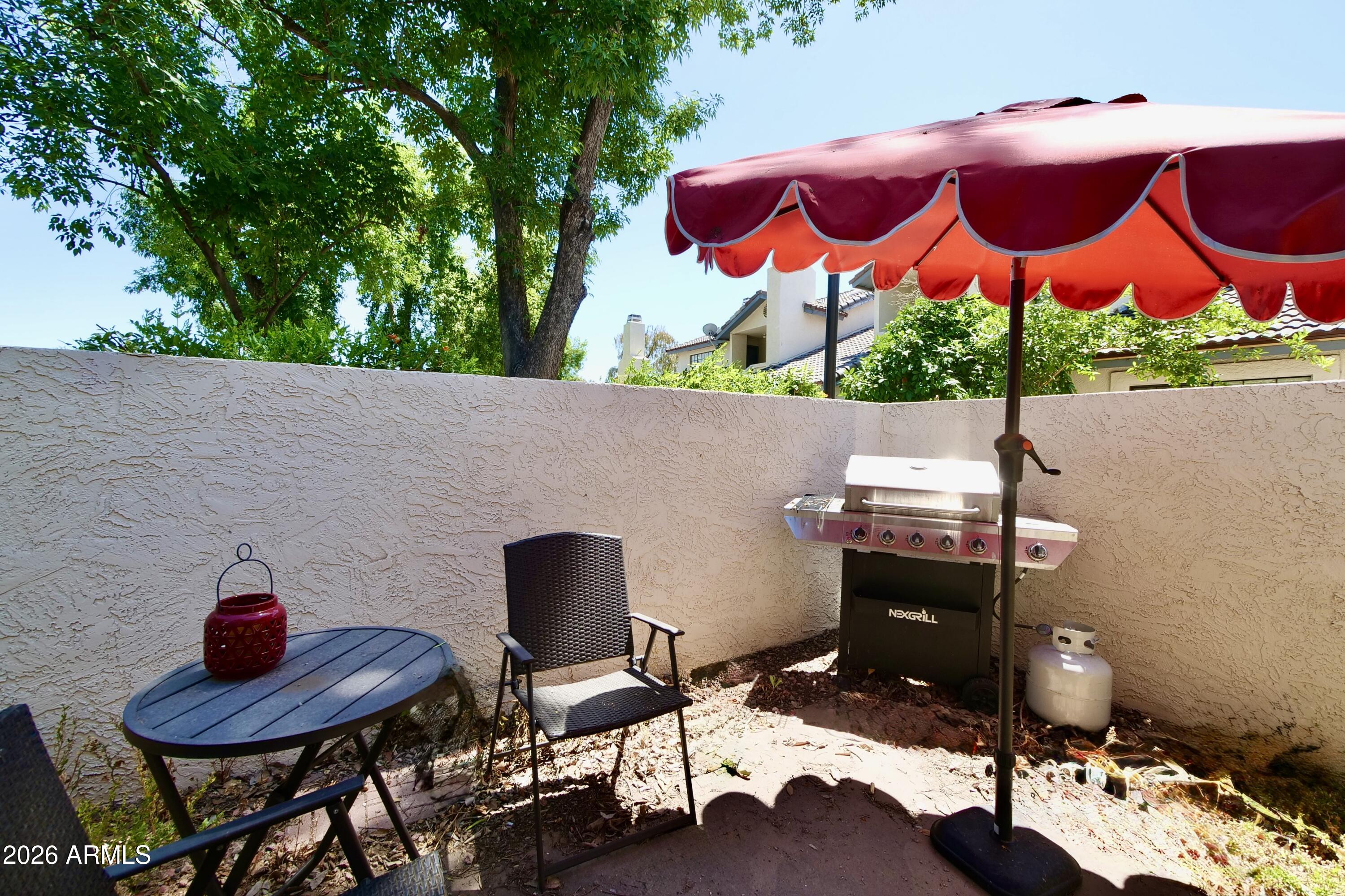 1222 West Baseline Road, Unit 156 Tempe, AZ 85283 - Photo 20 of 27 a view of an outdoor sitting area with lounge chair