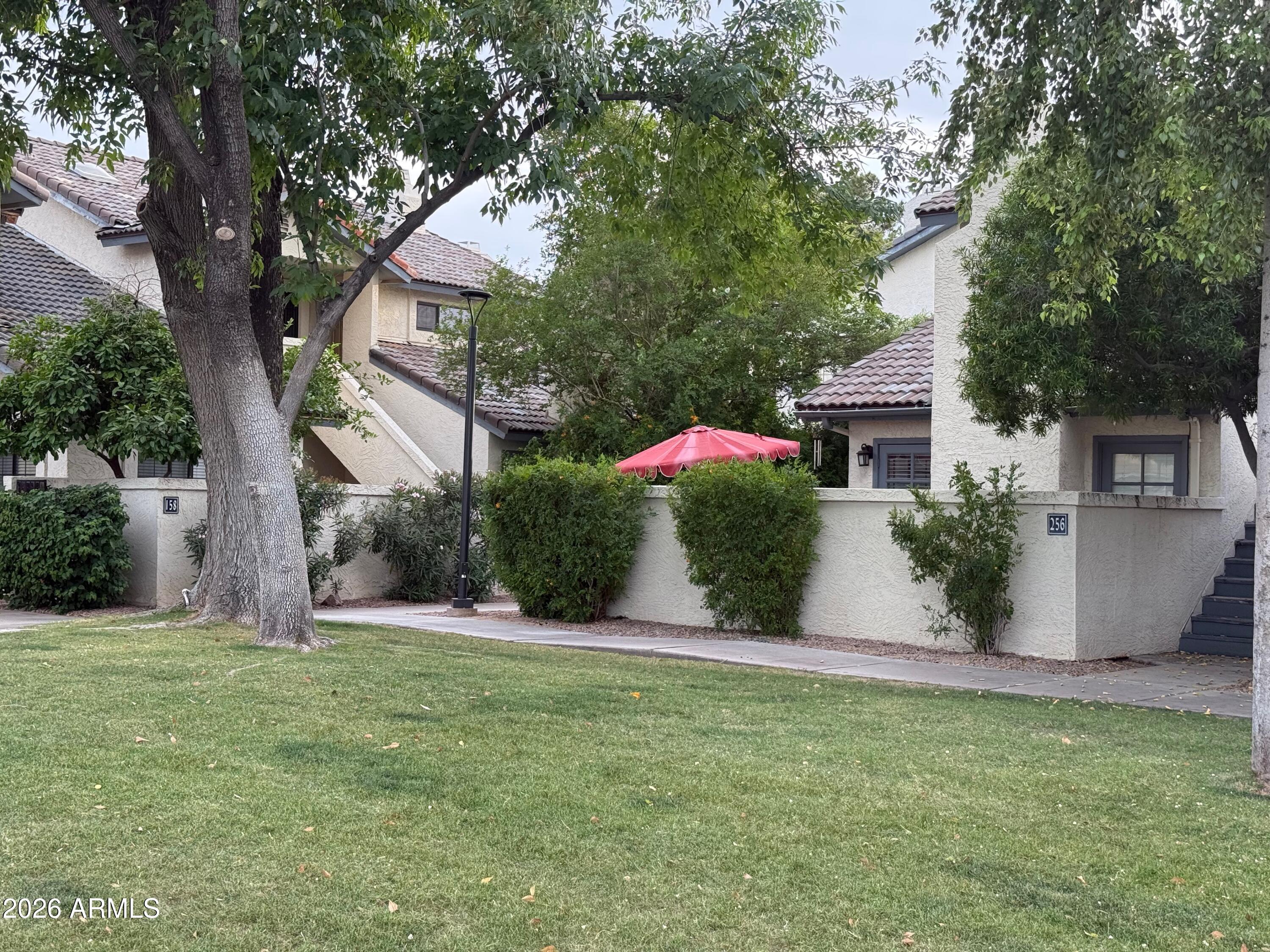 1222 West Baseline Road, Unit 156 Tempe, AZ 85283 - Photo 22 of 27 a view of a house with a backyard