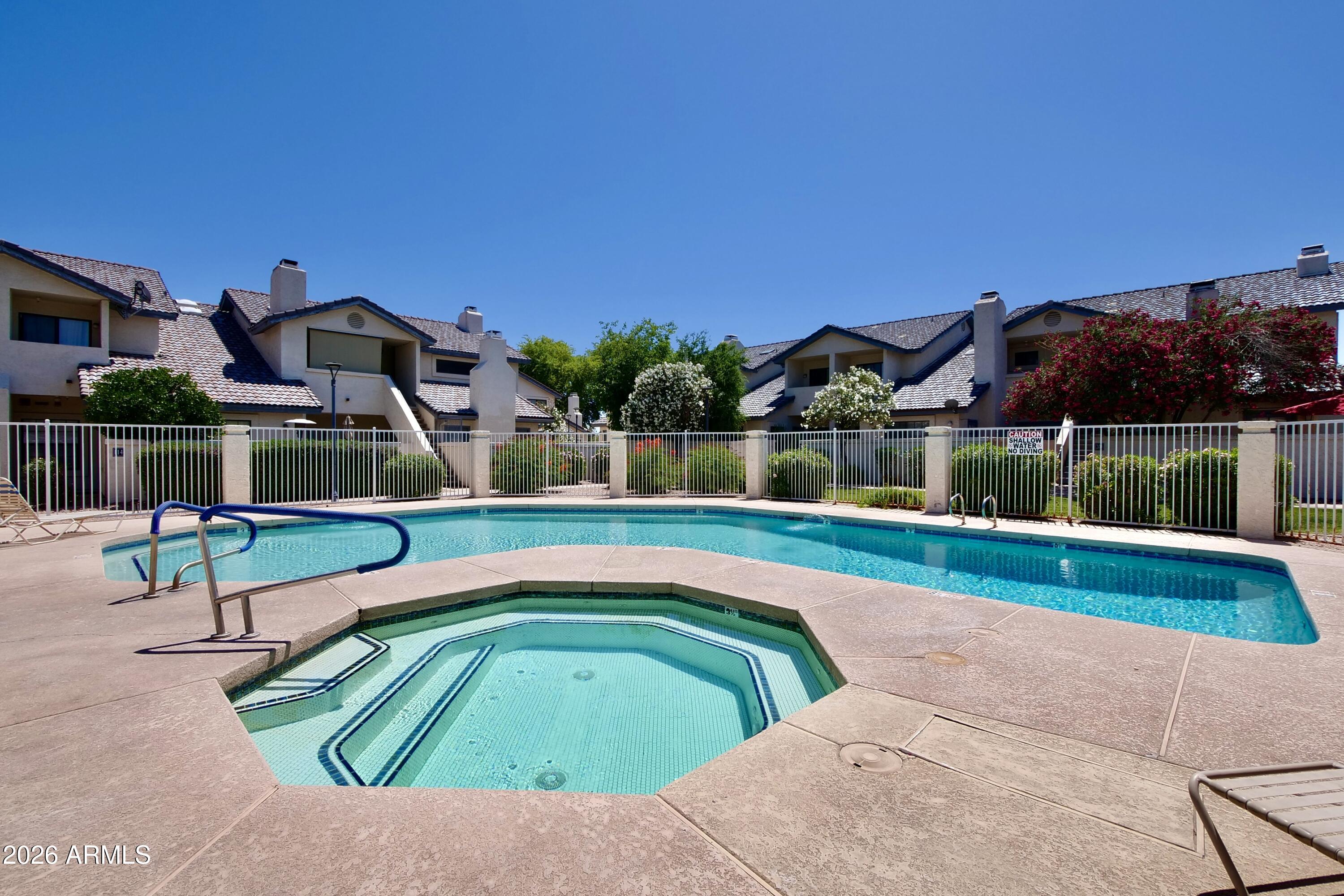 1222 West Baseline Road, Unit 156 Tempe, AZ 85283 - Photo 24 of 27 a view of swimming pool with a lounge chair