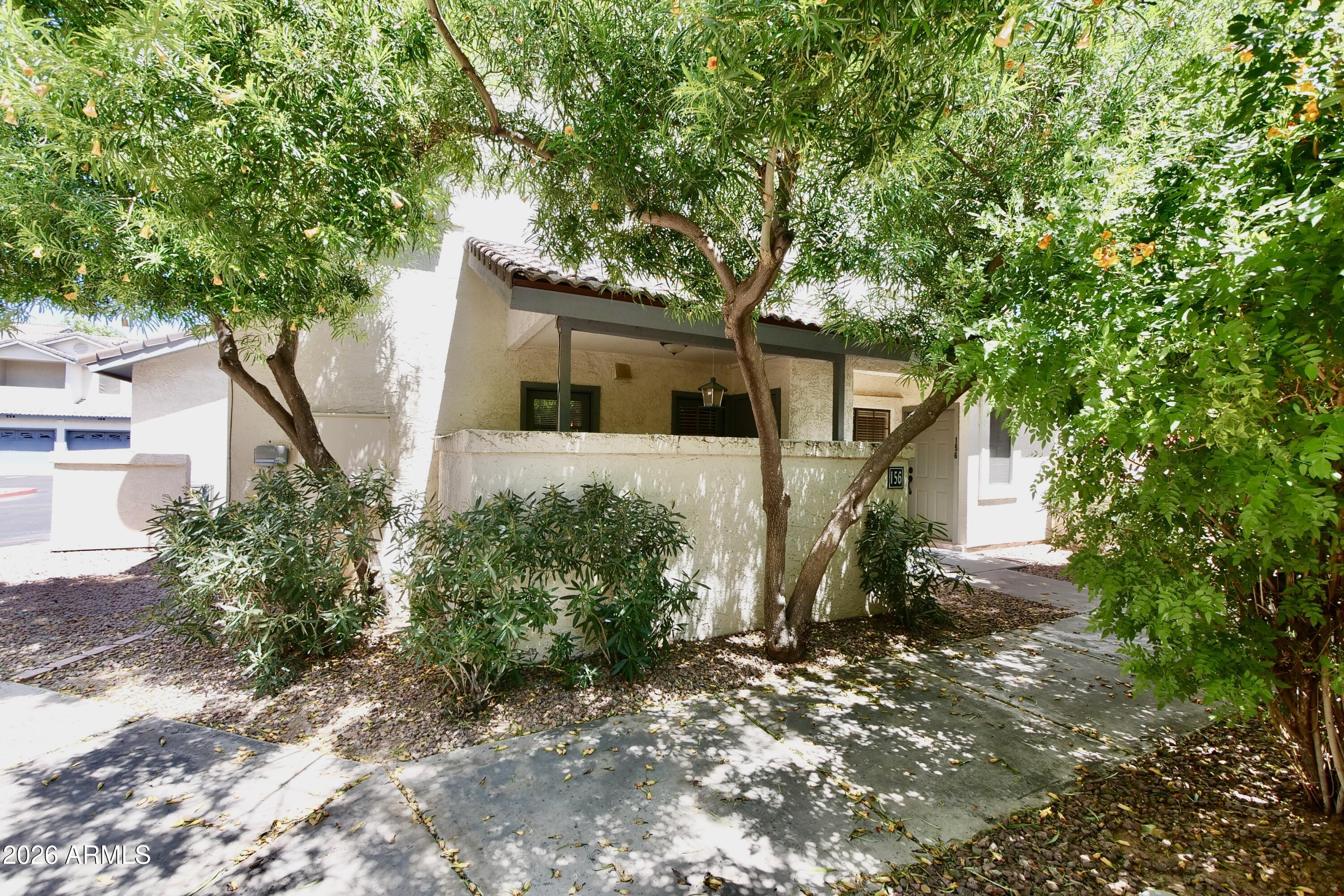 1222 West Baseline Road, Unit 156 Tempe, AZ 85283 - Photo 27 of 27 a front view of a house with garden