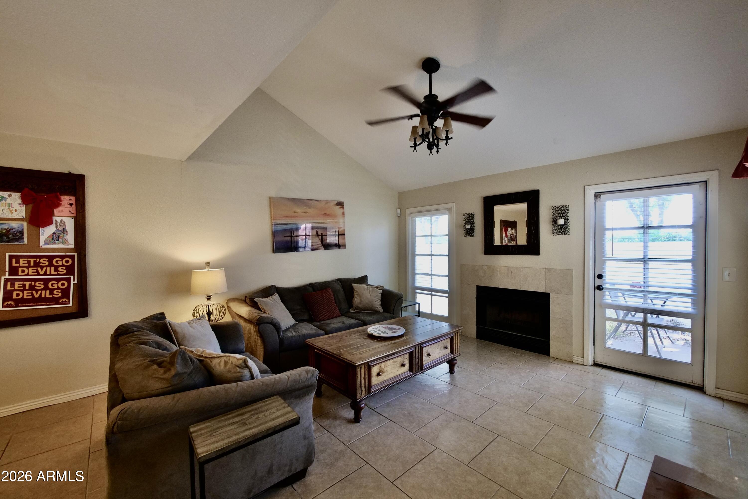 1222 West Baseline Road, Unit 156 Tempe, AZ 85283 - Photo 5 of 27 a living room with furniture and a fireplace