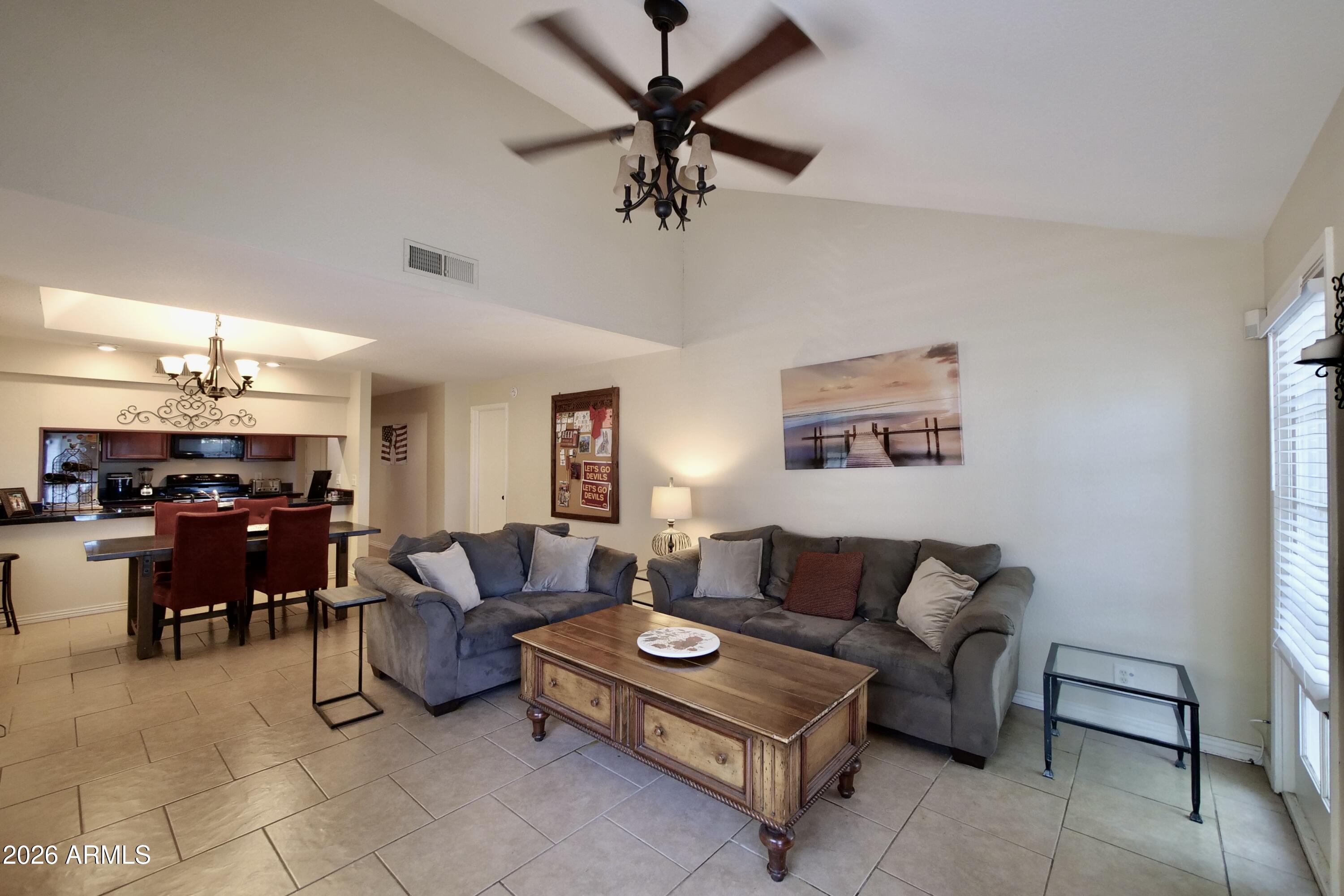 1222 West Baseline Road, Unit 156 Tempe, AZ 85283 - Photo 7 of 27 a living room with furniture and a window