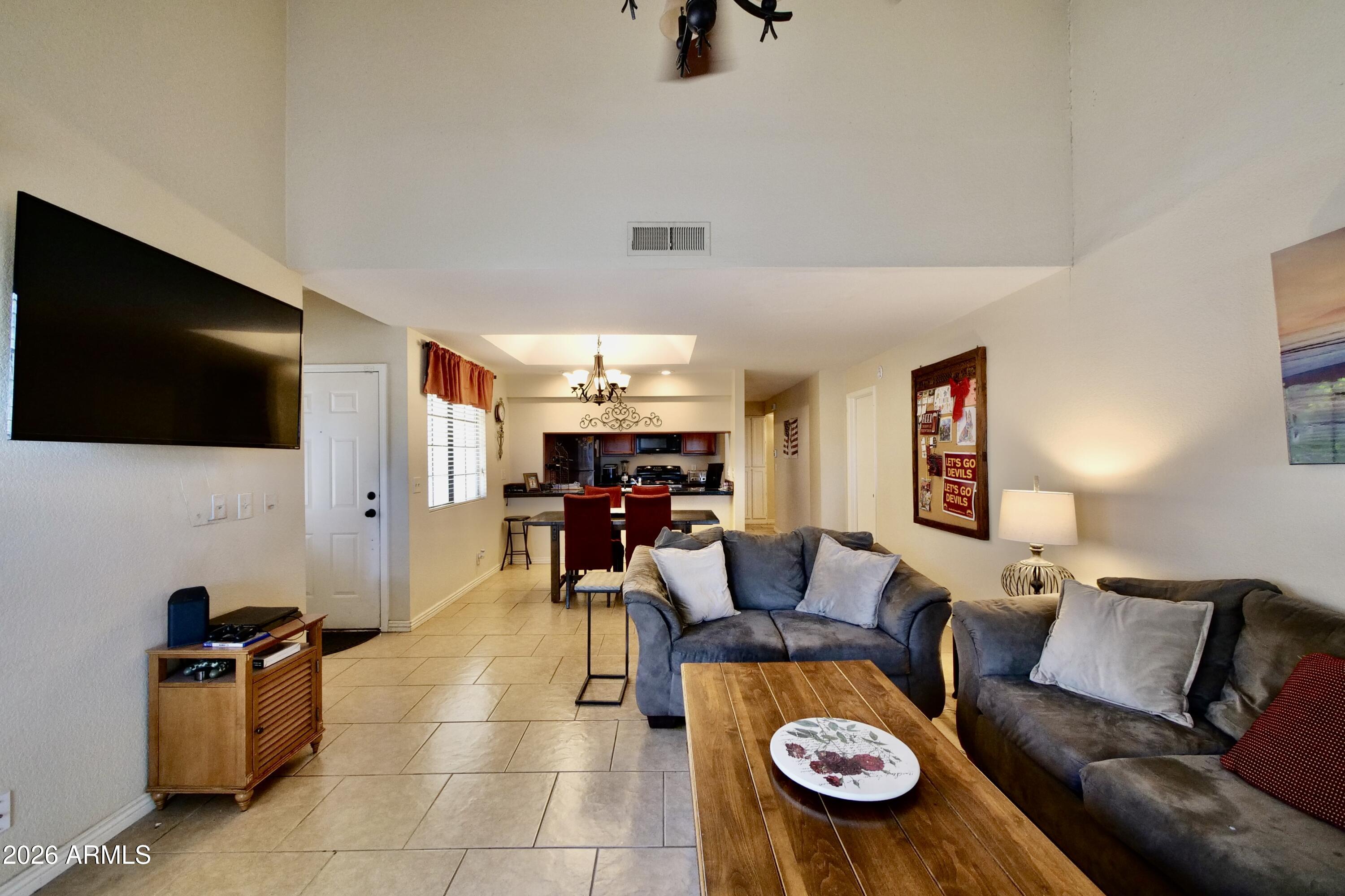 1222 West Baseline Road, Unit 156 Tempe, AZ 85283 - Photo 8 of 27 a living room with furniture and a flat screen tv