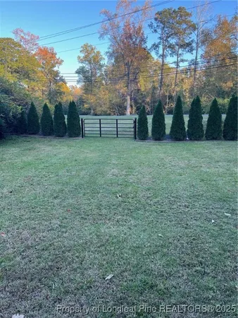 a view of outdoor space with deck and yard
