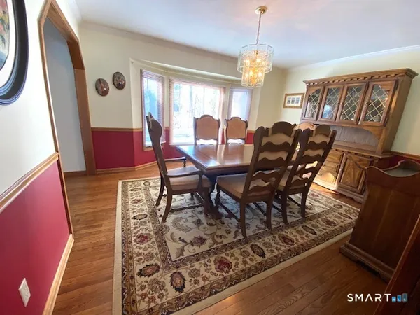 a view of a dining room with furniture and window