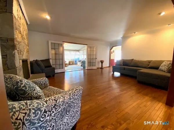 a living room with furniture and a flat screen tv