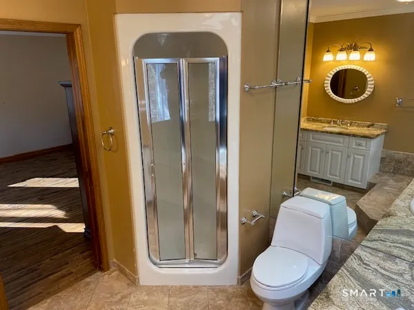 a bathroom with a toilet and a sink