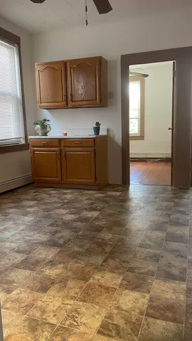 a kitchen with stainless steel appliances wooden cabinets a sink and a stove