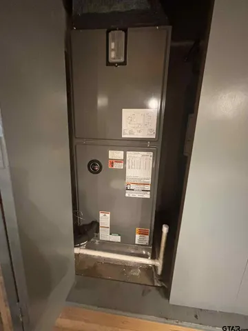 a view of a house with a yard covered in snow