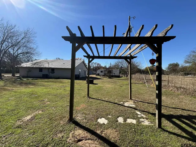 a view of a backyard of the house