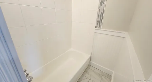 a bathroom with a bathtub