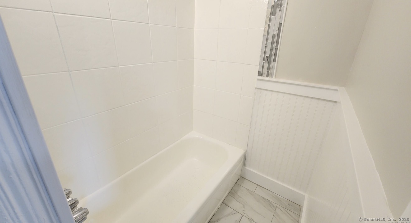 1514 Pembroke Street, Unit 2R Bridgeport, CT 06608 - Photo 7 of 7 a bathroom with a bathtub