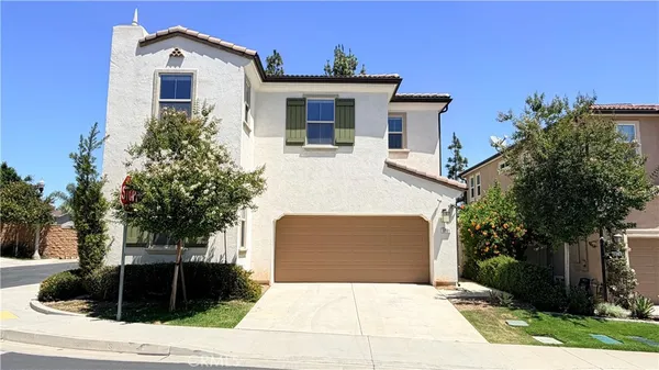 a front view of a house with garage