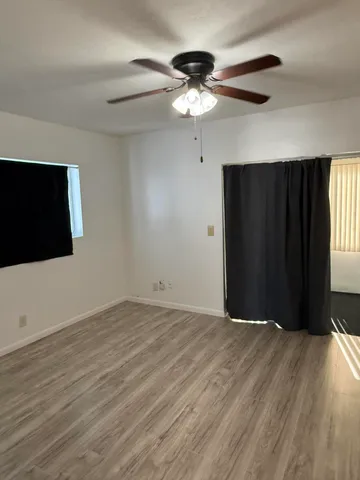 a view of swimming pool is middle in the garden