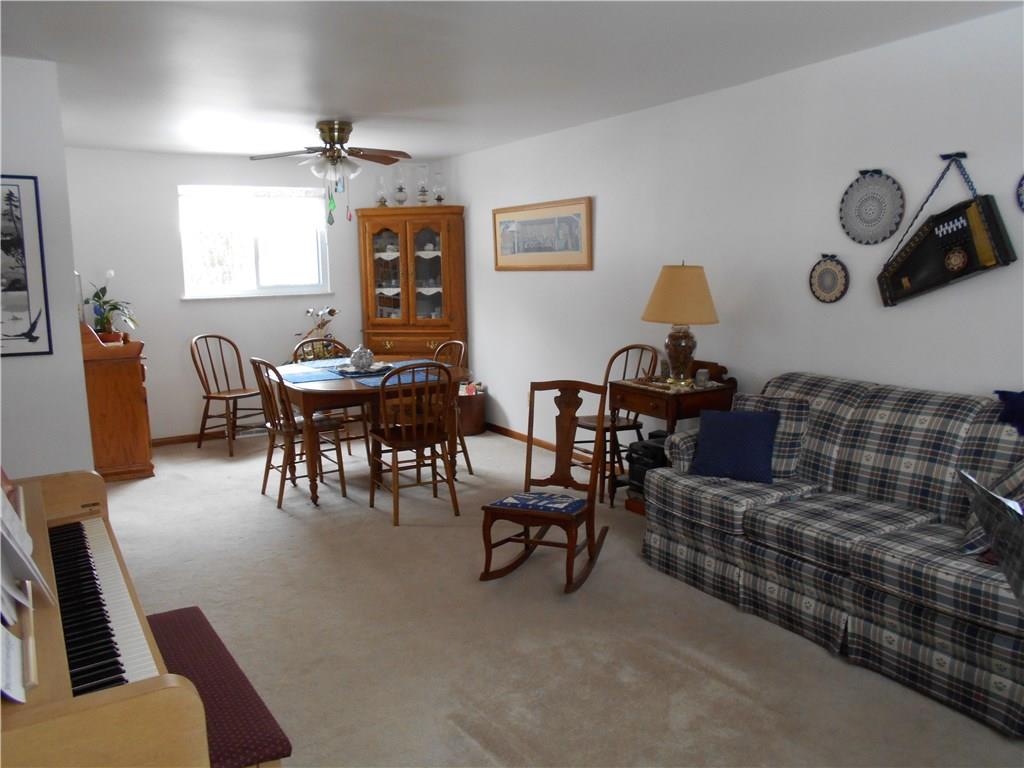 566 Filmore Road Pittsburgh, PA 15221 - Photo 11 of 25 Living room-dining room combo measures 23x12.