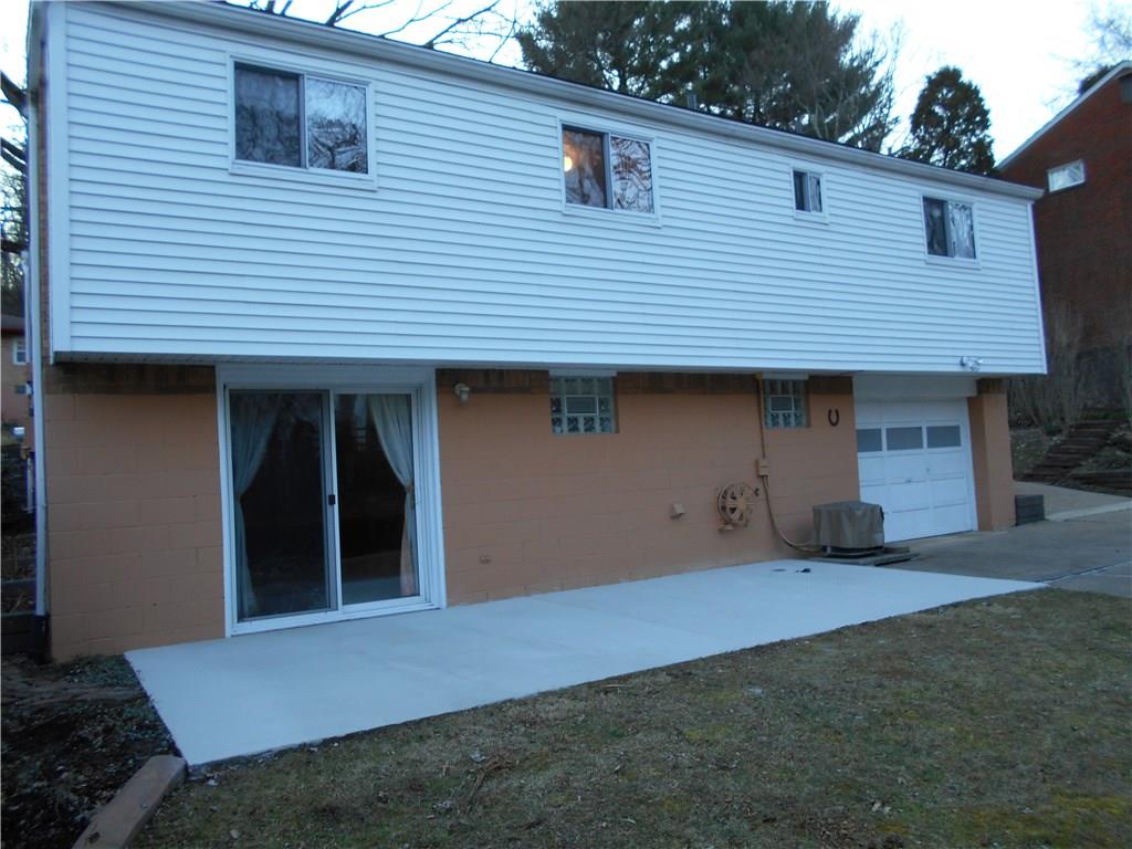 566 Filmore Road Pittsburgh, PA 15221 - Photo 4 of 25 One car integral garage is easily accessible off of the gently sloped driveway.