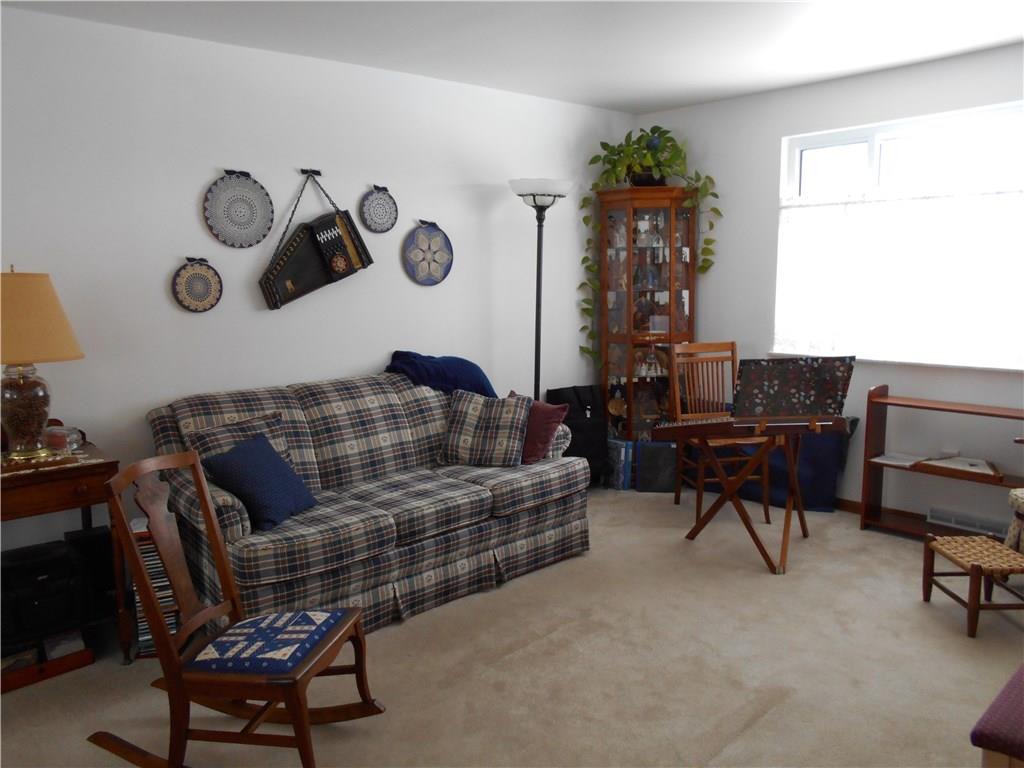 566 Filmore Road Pittsburgh, PA 15221 - Photo 9 of 25 Living room with large window invites a lot of natural light.
