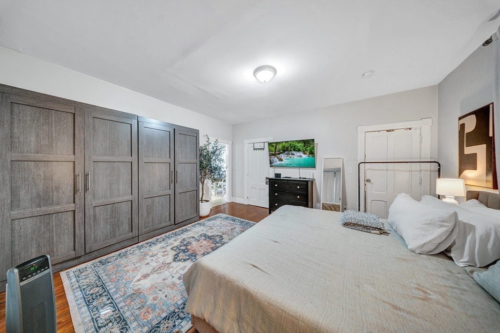 28 Richards Street Worcester, MA 01603 - Photo 14 of 42 a bed room with a bed and a dresser