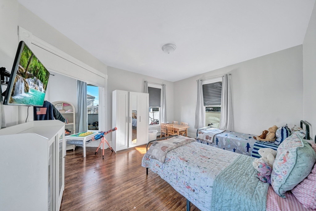 28 Richards Street Worcester, MA 01603 - Photo 16 of 42 a living room with furniture and a wooden floor