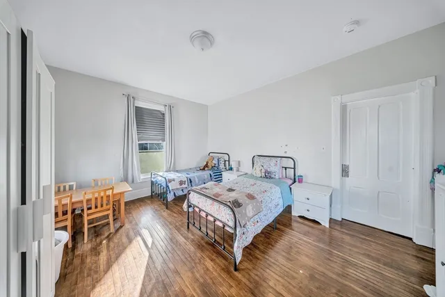 a view of an entryway with wooden floor