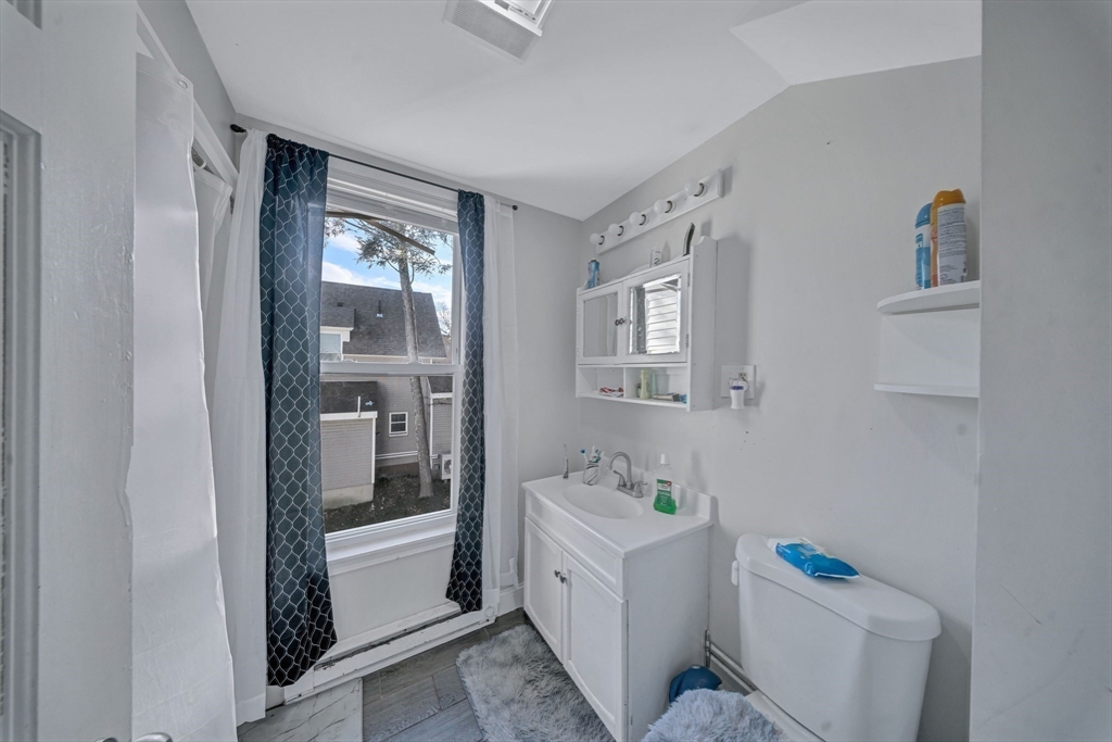 28 Richards Street Worcester, MA 01603 - Photo 23 of 42 a bathroom with a sink a toilet and shower