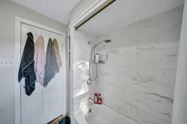 a kitchen with stainless steel appliances granite countertop a sink and a refrigerator
