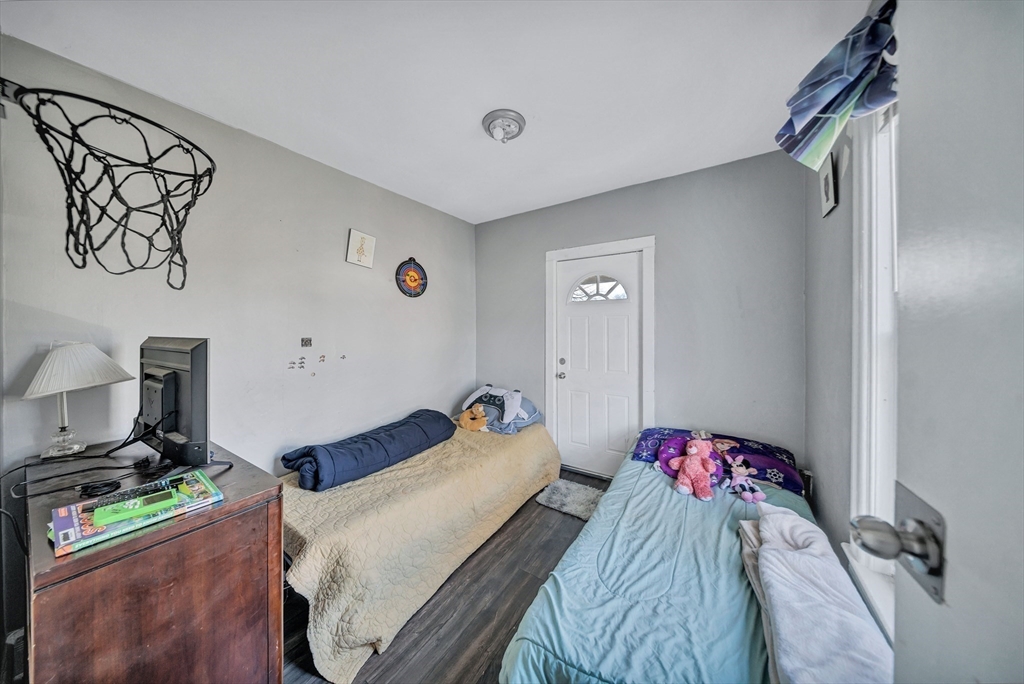 28 Richards Street Worcester, MA 01603 - Photo 31 of 42 a bedroom with a bed and a dresser