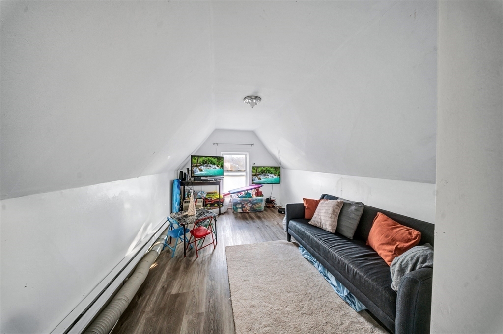 28 Richards Street Worcester, MA 01603 - Photo 36 of 42 a living room with furniture and wooden floor