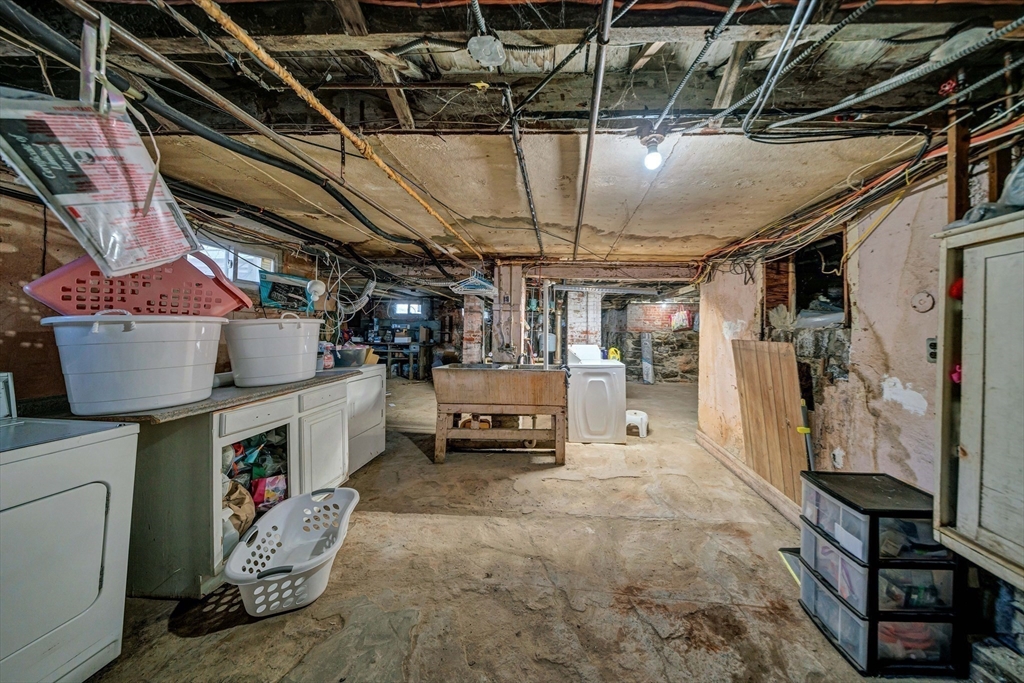 28 Richards Street Worcester, MA 01603 - Photo 39 of 42 a view of storage and utility room