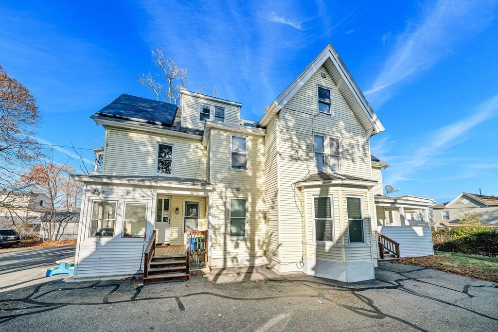 28 Richards Street Worcester, MA 01603 - Photo 5 of 42 a view of a building with a bench