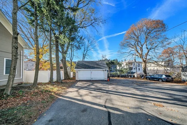 a view of a street with houses on the road