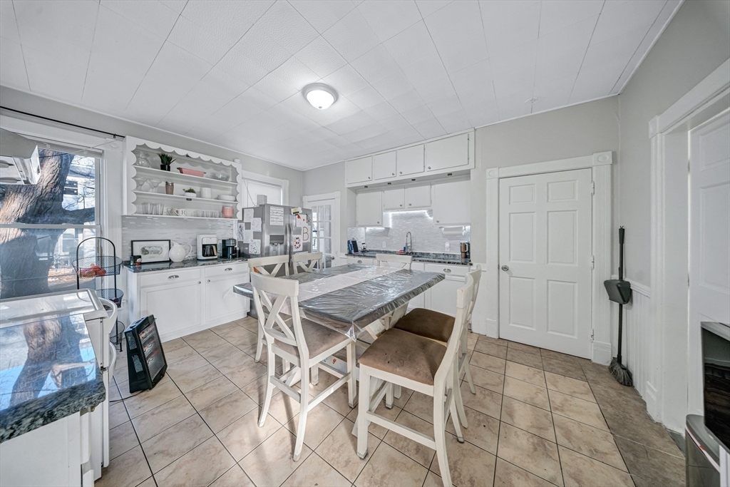 28 Richards Street Worcester, MA 01603 - Photo 9 of 42 a kitchen with a table and chairs