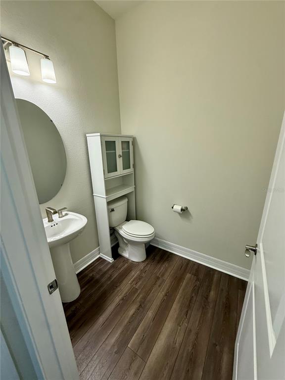 8441 Pk Clf Way Orlando, FL 32836 - Photo 50 of 59 a bathroom with a toilet and a mirror