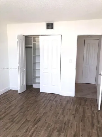 a view of a balcony with outdoor seating