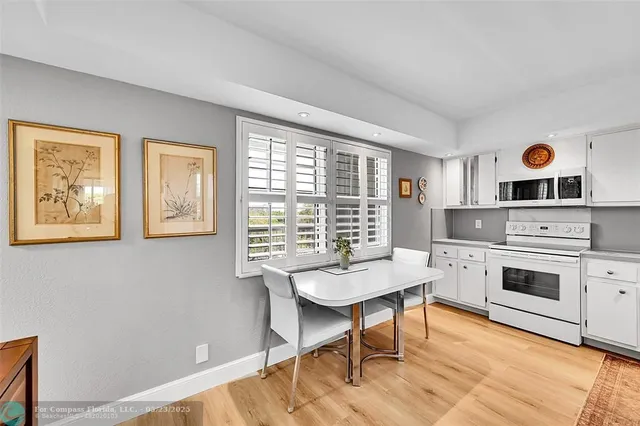 a workspace with furniture window and wooden floor