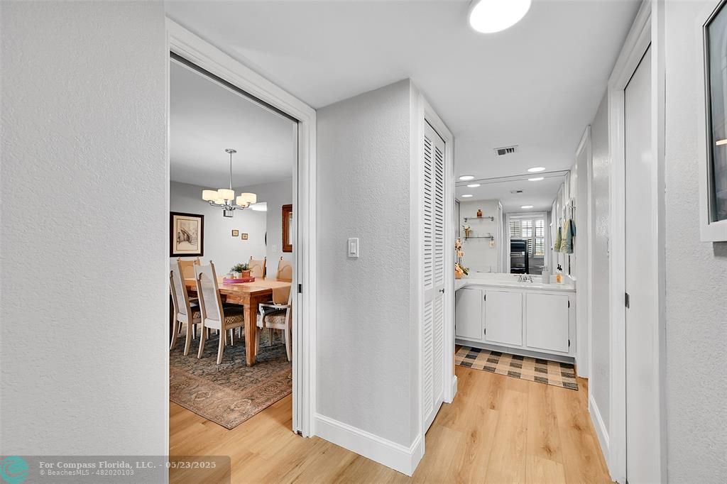 4020 West Palm Aire Drive, Unit 503 Pompano Beach, FL 33069 - Photo 20 of 53 a view of a dining area with furniture and chandelier