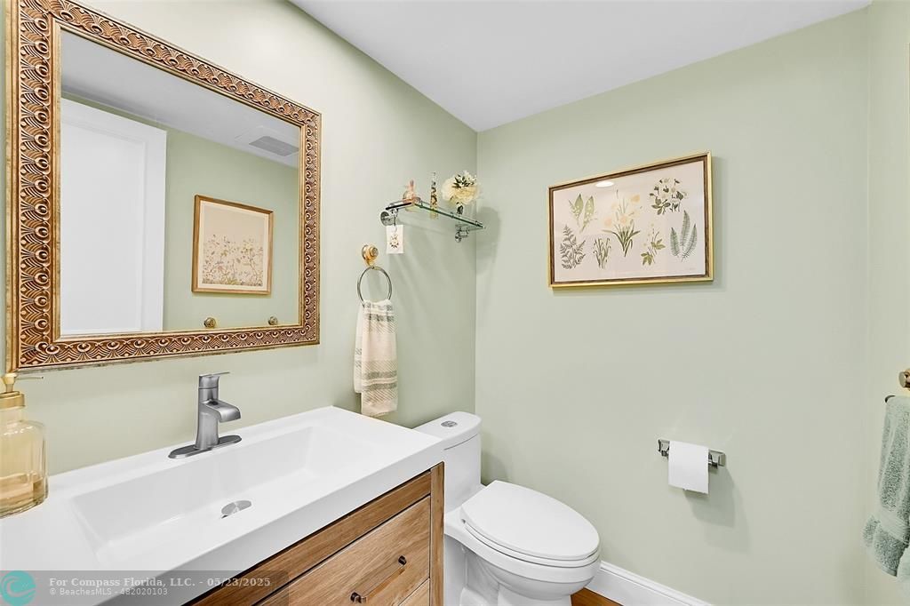 4020 West Palm Aire Drive, Unit 503 Pompano Beach, FL 33069 - Photo 29 of 53 a bathroom with a sink mirror vanity and toilet