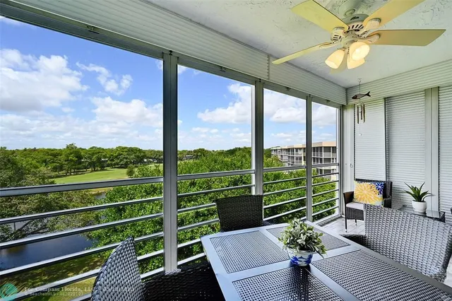 a view of a chairs and tables in the balcony