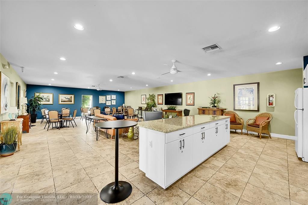 4020 West Palm Aire Drive, Unit 503 Pompano Beach, FL 33069 - Photo 40 of 53 a living room with furniture a table and chairs