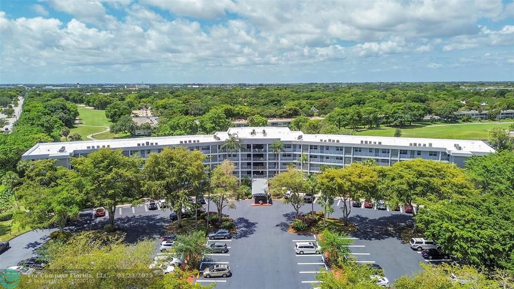 4020 West Palm Aire Drive, Unit 503 Pompano Beach, FL 33069 - Photo 45 of 53 a view of a garden