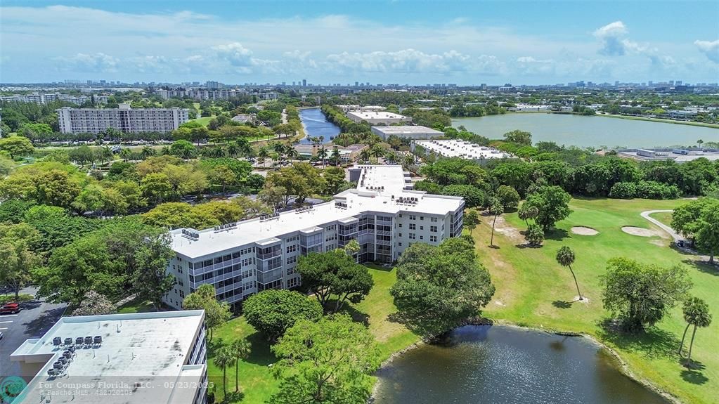 4020 West Palm Aire Drive, Unit 503 Pompano Beach, FL 33069 - Photo 49 of 53 an aerial view of a city with lake view