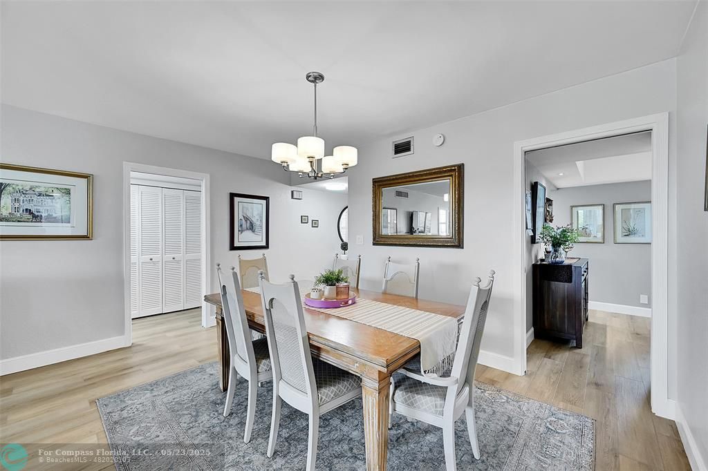 4020 West Palm Aire Drive, Unit 503 Pompano Beach, FL 33069 - Photo 5 of 53 a view of a dining room with furniture and wooden floor