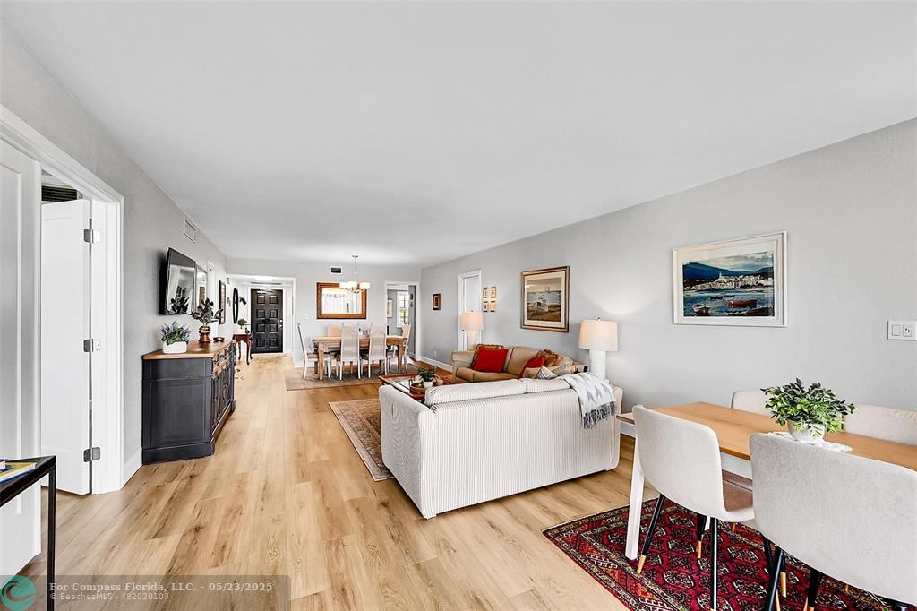 4020 West Palm Aire Drive, Unit 503 Pompano Beach, FL 33069 - Photo 7 of 53 a living room with furniture and a table