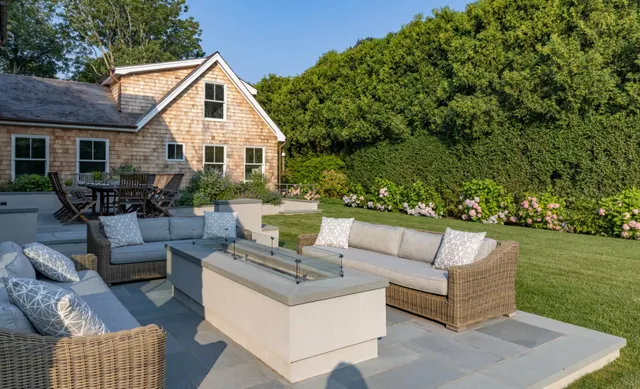 a view of a house and couches with wooden floor