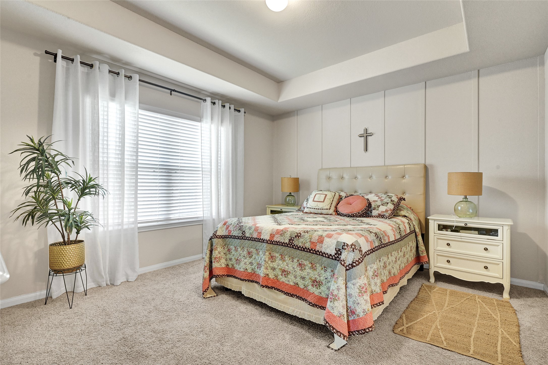 1329 Mount Blanc Path Conroe, TX 77301 - Photo 11 of 23 a bedroom with a bed a mirror and a window