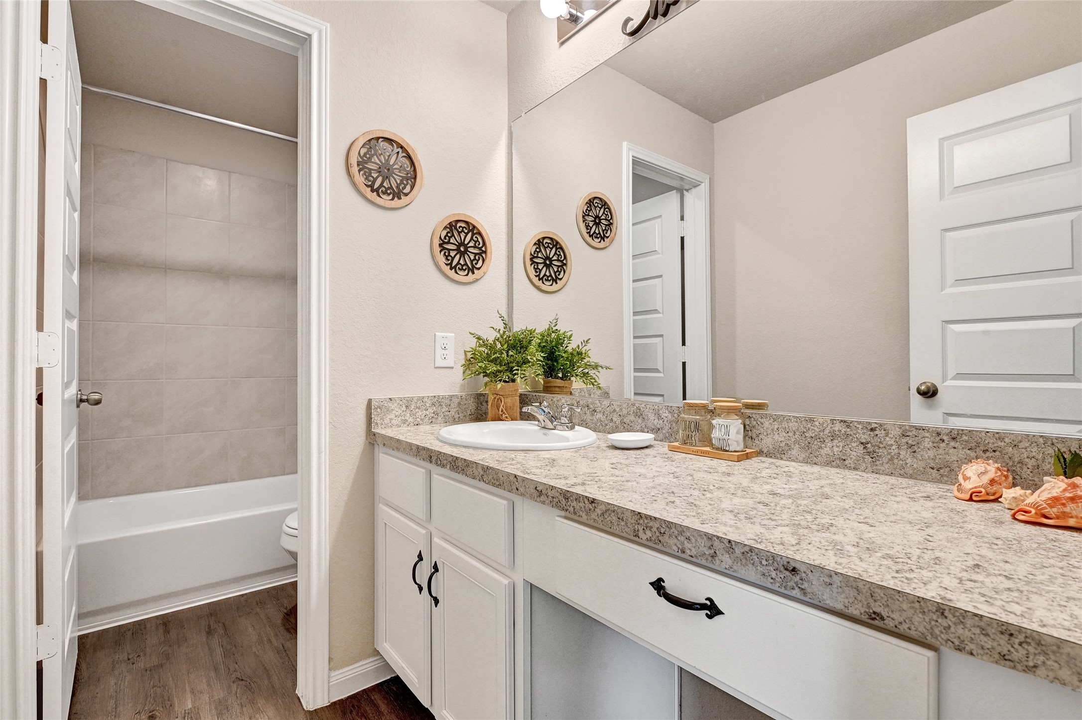 1329 Mount Blanc Path Conroe, TX 77301 - Photo 15 of 23 a bathroom with a granite countertop sink and a mirror